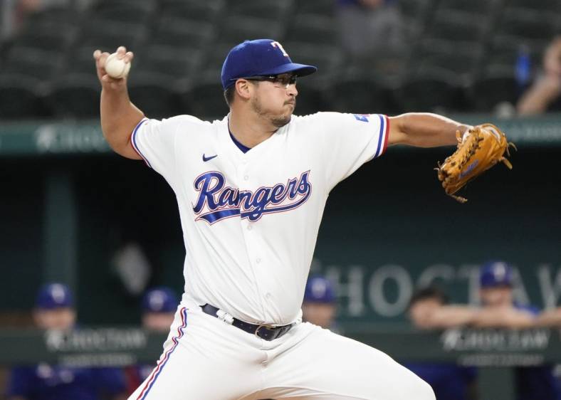 Aug 18, 2022; Arlington, Texas, USA; Texas Rangers starting pitcher Dane Dunning (33) delivers a pitch to the Oakland Athletics during the first inning at Globe Life Field. Mandatory Credit: Jim Cowsert-USA TODAY Sports