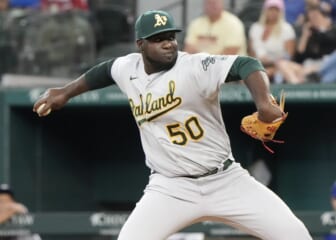 Aug 18, 2022; Arlington, Texas, USA; Oakland Athletics relief pitcher Domingo Tapia (50) delivers a pitch to the Texas Rangers during the fifth inning at Globe Life Field. Mandatory Credit: Jim Cowsert-USA TODAY Sports