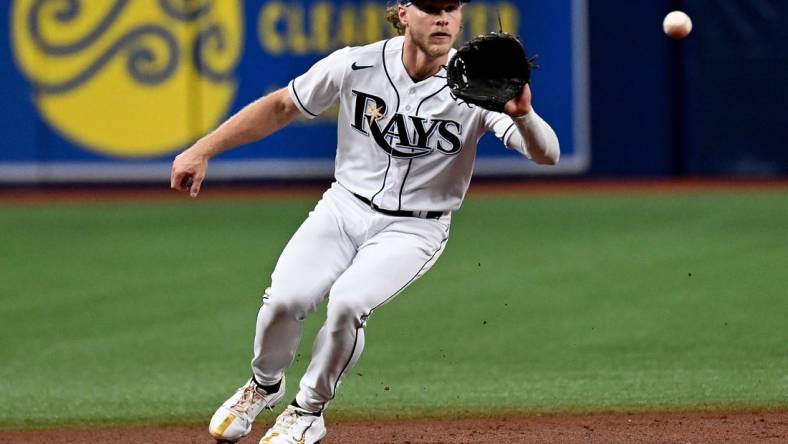 Aug 18, 2022; St. Petersburg, Florida, USA; Tampa Bay Rays shortstop Taylor Walls (0) fields a ground ball in the second inning against the Kansas City Royals at Tropicana Field. Mandatory Credit: Jonathan Dyer-USA TODAY Sports