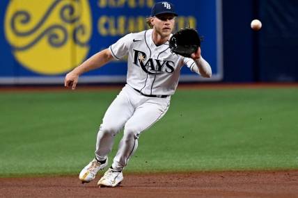 Aug 18, 2022; St. Petersburg, Florida, USA; Tampa Bay Rays shortstop Taylor Walls (0) fields a ground ball in the second inning against the Kansas City Royals at Tropicana Field. Mandatory Credit: Jonathan Dyer-USA TODAY Sports