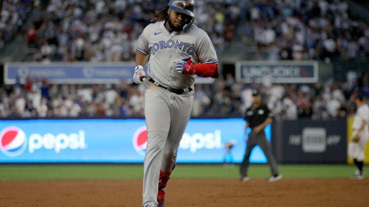 Aug 18, 2022; Bronx, New York, USA; Toronto Blue Jays first baseman Vladimir Guerrero Jr. (27) rounds the bases after hitting a three run home run against the New York Yankees during the second inning at Yankee Stadium. Mandatory Credit: Brad Penner-USA TODAY Sports