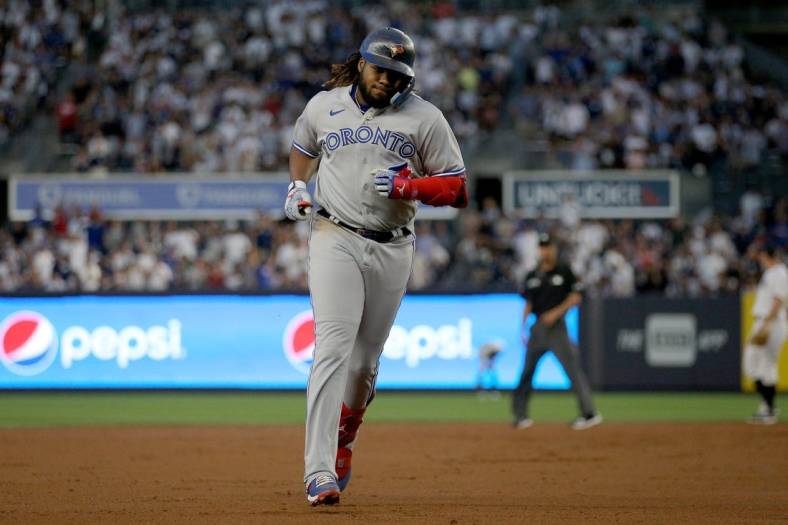 Aug 18, 2022; Bronx, New York, USA; Toronto Blue Jays first baseman Vladimir Guerrero Jr. (27) rounds the bases after hitting a three run home run against the New York Yankees during the second inning at Yankee Stadium. Mandatory Credit: Brad Penner-USA TODAY Sports