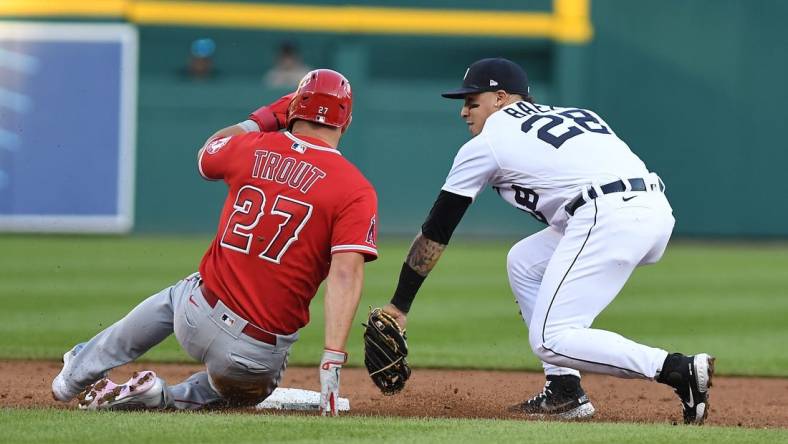 Aug 19, 2022; Detroit, Michigan, USA; Los Angeles Angels center fielder Mike Trout (27) is tagged out at second base by Detroit Tigers shortstop Javier Baez (28) to end the third inning on a fielder's choice at Comerica Park. Mandatory Credit: Lon Horwedel-USA TODAY Sports