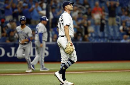 Aug 19, 2022; St. Petersburg, Florida, USA; Tampa Bay Rays starting pitcher Shane McClanahan (18) looks on as he gives up a two run home run against the Kansas City Royals during the third inning at Tropicana Field. Mandatory Credit: Kim Klement-USA TODAY Sports