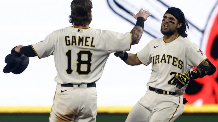 Aug 19, 2022; Pittsburgh, Pennsylvania, USA; Pittsburgh Pirates first baseman Michael Chavis (2) celebrates his game winning walk off single with right fielder Ben Gamel (18) to defeat the Cincinnati Reds during the ninth inning at PNC Park. The Pirates won 5-4. Mandatory Credit: Charles LeClaire-USA TODAY Sports