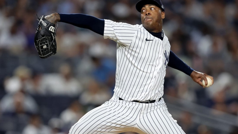Aug 19, 2022; Bronx, New York, USA; New York Yankees relief pitcher Aroldis Chapman (54) pitches against the Toronto Blue Jays during the ninth inning at Yankee Stadium. Mandatory Credit: Brad Penner-USA TODAY Sports