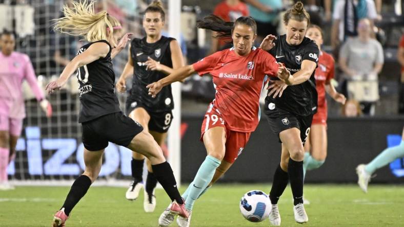 Aug 19, 2022; Kansas City, Kansas, USA;  Kansas City Current midfielder Victoria Pickett (99) controls the ball as Angel City FC forward Tyler Lussi (20) defends during the second half at Children's Mercy Park. Mandatory Credit: Amy Kontras-USA TODAY Sports