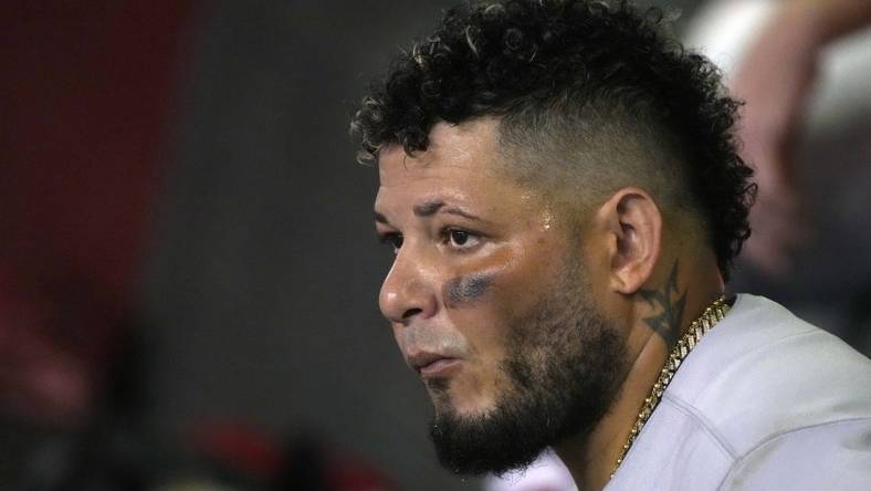 Aug 19, 2022; Phoenix, Arizona, USA; St. Louis Cardinals catcher Yadier Molina (4) watches from the dugout in the fourth inning against the Arizona Diamondbacks at Chase Field. Mandatory Credit: Rick Scuteri-USA TODAY Sports