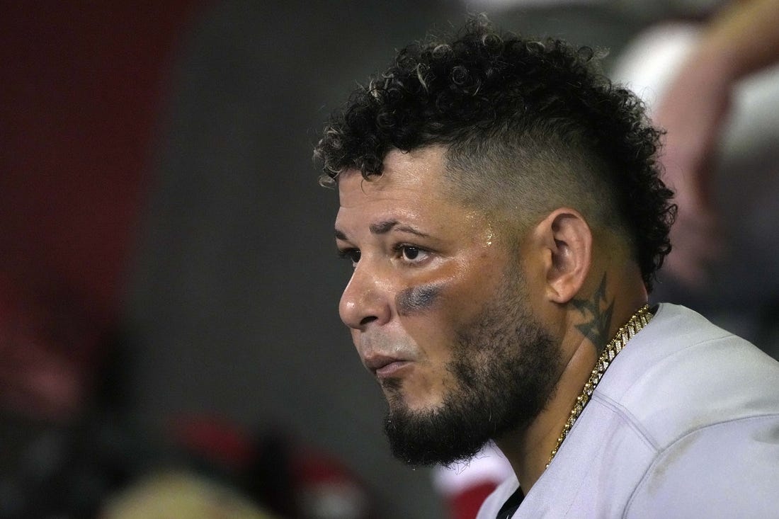 Aug 19, 2022; Phoenix, Arizona, USA; St. Louis Cardinals catcher Yadier Molina (4) watches from the dugout in the fourth inning against the Arizona Diamondbacks at Chase Field. Mandatory Credit: Rick Scuteri-USA TODAY Sports