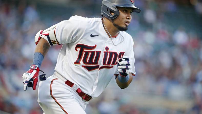 Aug 19, 2022; Minneapolis, Minnesota, USA; Minnesota Twins first baseman Luis Arraez (2) runs the bases on his solo home run against the Texas Rangers in the first inning at Target Field. Mandatory Credit: Bruce Kluckhohn-USA TODAY Sports