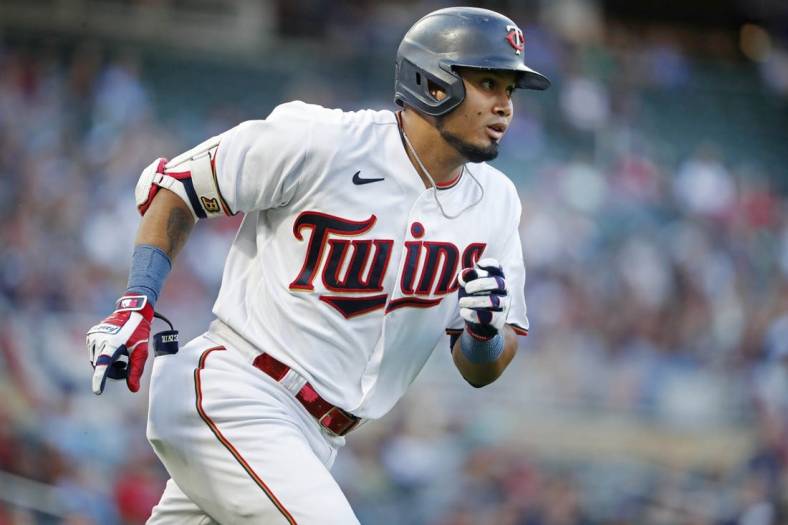 Aug 19, 2022; Minneapolis, Minnesota, USA; Minnesota Twins first baseman Luis Arraez (2) runs the bases on his solo home run against the Texas Rangers in the first inning at Target Field. Mandatory Credit: Bruce Kluckhohn-USA TODAY Sports