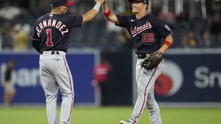 Aug 19, 2022; San Diego, California, USA;  Washington Nationals right fielder Alex Call (62) greets second baseman Cesar Hernandez (1) after the game against the San Diego Padres at Petco Park. Mandatory Credit: Ray Acevedo-USA TODAY Sports