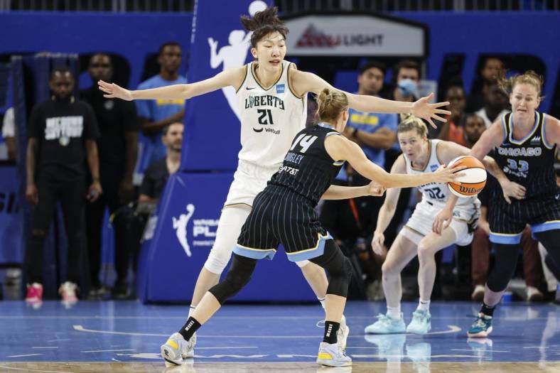 Aug 20, 2022; Chicago, Illinois, USA; New York Liberty center Han Xu (21) defends against Chicago Sky guard Allie Quigley (14) during the first half of Game 2 of the first round of the WNBA playoffs at Wintrust Arena. Mandatory Credit: Kamil Krzaczynski-USA TODAY Sports