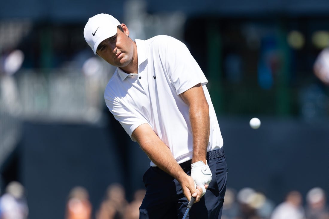 Aug 20, 2022; Wilmington, Delaware, USA; Scottie Scheffler chips onto the second green during the third round of the BMW Championship golf tournament. Mandatory Credit: Bill Streicher-USA TODAY Sports