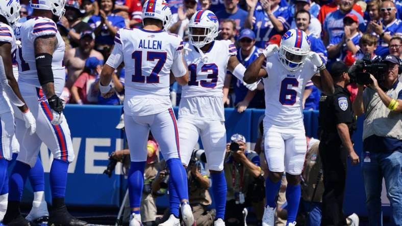 Aug 20, 2022; Orchard Park, New York, USA; Buffalo Bills quarterback Josh Allen (17) congratulates Buffalo Bills wide receiver Gabriel Davis (13) for catching a touchdown pass during the first half against the Denver Broncos at Highmark Stadium. Mandatory Credit: Gregory Fisher-USA TODAY Sports