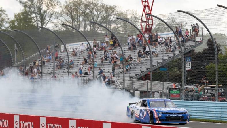 Aug 20, 2022; Watkins Glen, New York, USA; NASCAR Xfinity Series driver Kyle Larson (88) celebrates after winning the Sunoco Go Rewards 200 at Watkins Glen International. Mandatory Credit: Matthew OHaren-USA TODAY Sports