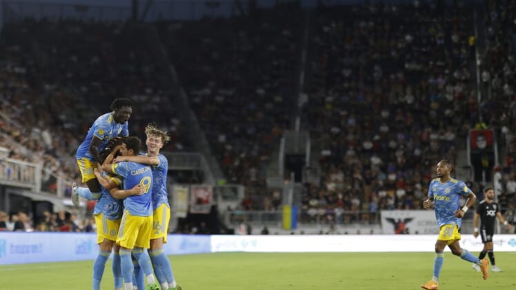 Aug 20, 2022; Washington, District of Columbia, USA; Philadelphia Union forward Mikael Uhre (7) celebrates with teammates after scoring a goal against D.C. United in the first half at Audi Field. Mandatory Credit: Geoff Burke-USA TODAY Sports