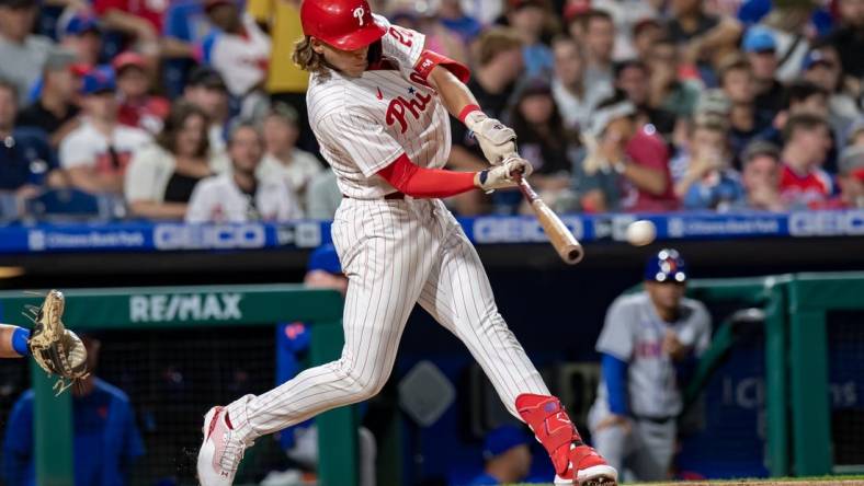 Aug 20, 2022; Philadelphia, Pennsylvania, USA; Philadelphia Phillies third baseman Alec Bohm (28) hits a two RBI double against the New York Mets during the third inning at Citizens Bank Park. Mandatory Credit: John Jones-USA TODAY Sports