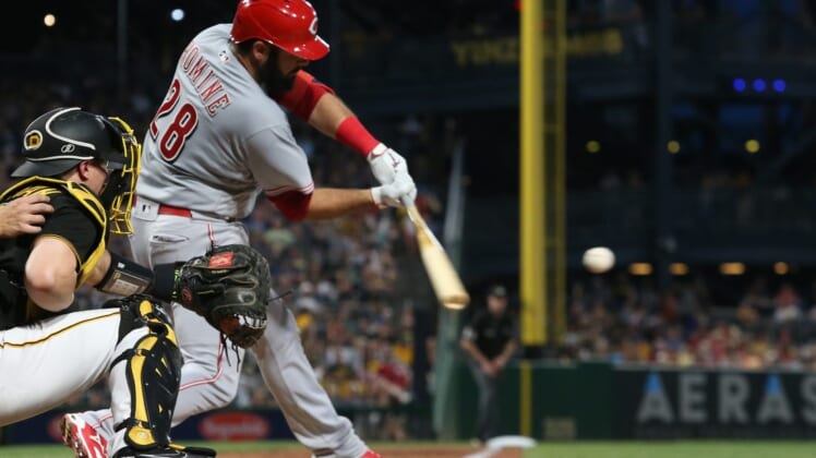 Aug 20, 2022; Pittsburgh, Pennsylvania, USA;  Cincinnati Reds catcher Austin Romine (28) hits a two-run double against the Pittsburgh Pirates during the fourth inning at PNC Park. Mandatory Credit: Charles LeClaire-USA TODAY Sports