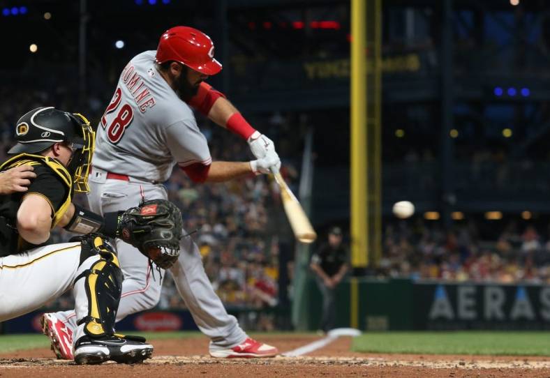 Aug 20, 2022; Pittsburgh, Pennsylvania, USA;  Cincinnati Reds catcher Austin Romine (28) hits a two-run double against the Pittsburgh Pirates during the fourth inning at PNC Park. Mandatory Credit: Charles LeClaire-USA TODAY Sports