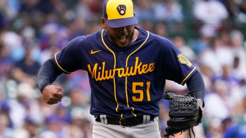 Milwaukee Brewers starting pitcher Freddy Peralta reacts as he walks to the dugout after the fifth inning of a baseball game against the Chicago Cubs in Chicago, Saturday, Aug. 20, 2022.Freddy Peralta