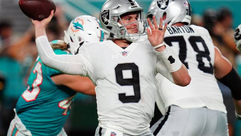 Aug 20, 2022; Miami Gardens, Florida, USA; Las Vegas Raiders quarterback Nick Mullens (9) throws a pass against the Miami Dolphins in the second quarter at Hard Rock Stadium. Mandatory Credit: Jim Rassol-USA TODAY Sports