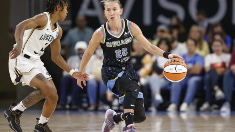 Aug 20, 2022; Chicago, Illinois, USA; Chicago Sky guard Courtney Vandersloot (22) is defended by New York Liberty guard Crystal Dangerfield (3) during the first half of Game 2 of the first round of the WNBA playoffs at Wintrust Arena. Mandatory Credit: Kamil Krzaczynski-USA TODAY Sports