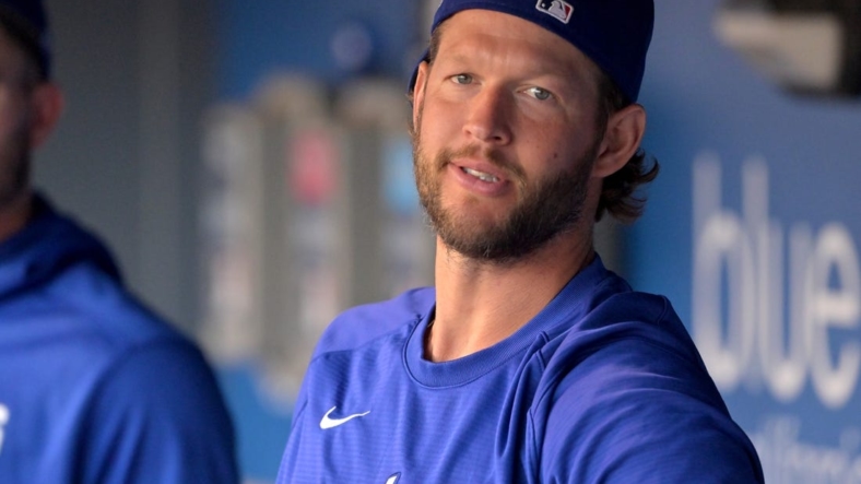 Aug 20, 2022; Los Angeles, California, USA;  Los Angeles Dodgers starting pitcher Clayton Kershaw (22) looks on from the dugout prior to a game against the Miami Marlins at Dodger Stadium. Mandatory Credit: Jayne Kamin-Oncea-USA TODAY Sports