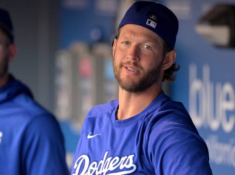 Aug 20, 2022; Los Angeles, California, USA;  Los Angeles Dodgers starting pitcher Clayton Kershaw (22) looks on from the dugout prior to a game against the Miami Marlins at Dodger Stadium. Mandatory Credit: Jayne Kamin-Oncea-USA TODAY Sports