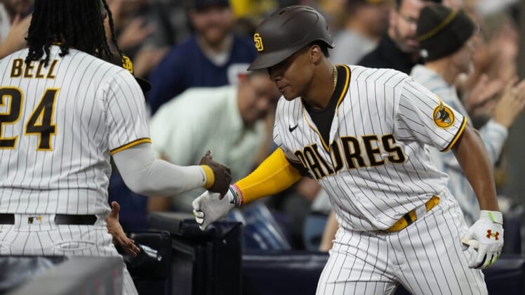 Aug 20, 2022; San Diego, California, USA;  San Diego Padres right fielder Juan Soto (22) greets designated hitter Josh Bell (left) after hitting a home run during the seventh inning against the Washington Nationals at Petco Park. Mandatory Credit: Ray Acevedo-USA TODAY Sports