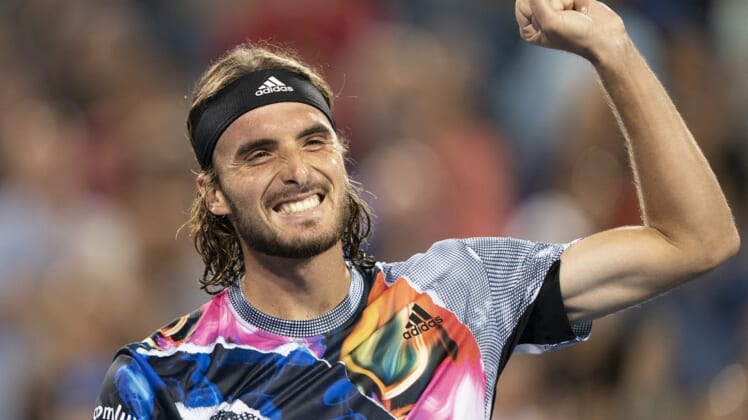 Aug 20, 2022; Cincinnati, OH, USA; Stefanos Tsitsipas (GRE) celebrates after defeating Daniil Medvedev (RUS) at the Western & Southern Open at the Lindner Family Tennis Center. Mandatory Credit: Susan Mullane-USA TODAY Sports