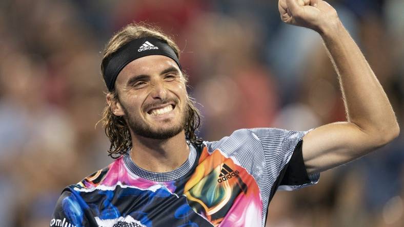 Aug 20, 2022; Cincinnati, OH, USA; Stefanos Tsitsipas (GRE) celebrates after defeating Daniil Medvedev (RUS) at the Western & Southern Open at the Lindner Family Tennis Center. Mandatory Credit: Susan Mullane-USA TODAY Sports