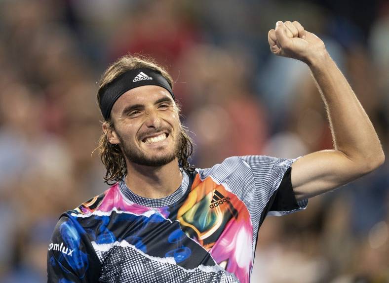 Aug 20, 2022; Cincinnati, OH, USA; Stefanos Tsitsipas (GRE) celebrates after defeating Daniil Medvedev (RUS) at the Western & Southern Open at the Lindner Family Tennis Center. Mandatory Credit: Susan Mullane-USA TODAY Sports