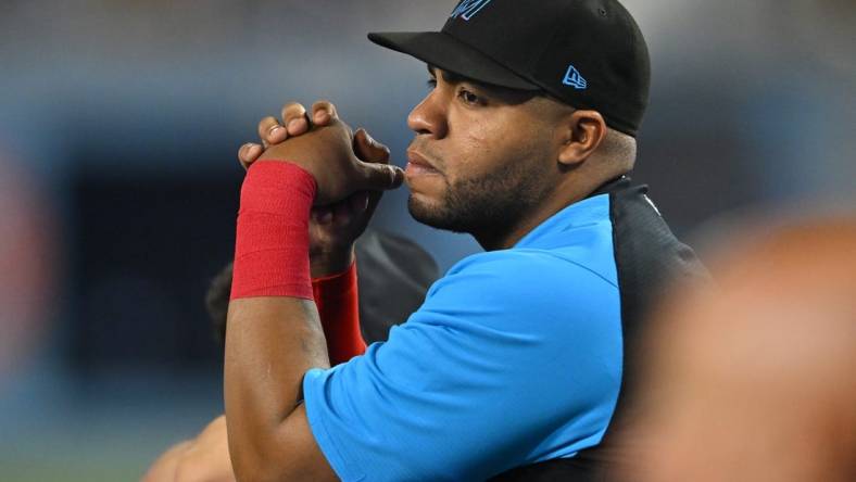 Aug 20, 2022; Los Angeles, California, USA;  Miami Marlins first baseman Jesus Aguilar (99) looks on from the dugout during the game against the Los Angeles Dodgers at Dodger Stadium. Mandatory Credit: Jayne Kamin-Oncea-USA TODAY Sports