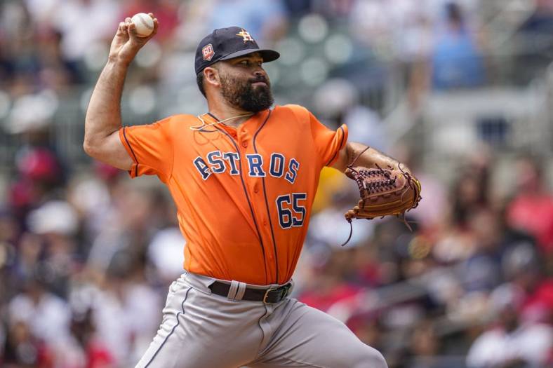 Aug 21, 2022; Cumberland, Georgia, USA; Houston Astros starting pitcher Jose Urquidy (65) pitches against the Atlanta Braves during the first inning at Truist Park. Mandatory Credit: Dale Zanine-USA TODAY Sports