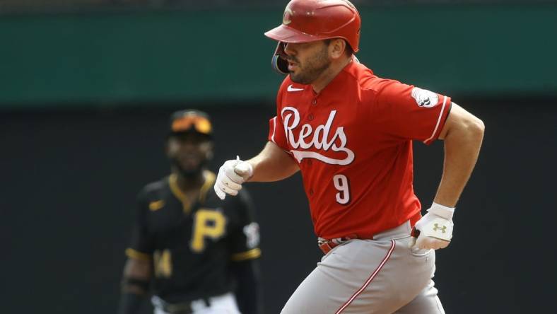 Aug 21, 2022; Pittsburgh, Pennsylvania, USA; Cincinnati Reds first baseman Mike Moustakas (9) rounds the bases after hitting a two run home run against the Pittsburgh Pirates during the third inning at PNC Park. Mandatory Credit: Charles LeClaire-USA TODAY Sports