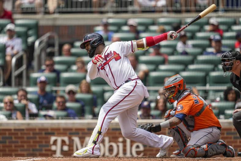 Aug 21, 2022; Cumberland, Georgia, USA; Atlanta Braves left fielder Marcell Ozuna (20) strikes out against the Houston Astros during the second inning at Truist Park. Mandatory Credit: Dale Zanine-USA TODAY Sports