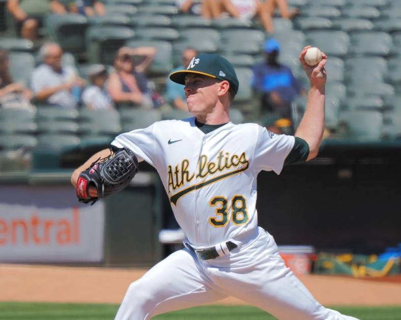 Aug 21, 2022; Oakland, California, USA; Oakland Athletics starting pitcher JP Sears (38) pitches the ball against the Seattle Mariners during the first inning at RingCentral Coliseum. Mandatory Credit: Kelley L Cox-USA TODAY Sports