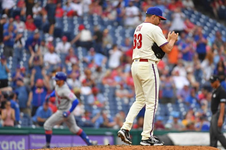 Aug 21, 2022; Philadelphia, Pennsylvania, USA; Philadelphia Phillies relief pitcher Tyler Cyr (63) reacts after allowing home run to New York Mets center fielder Brandon Nimmo (9) during the ninth inning at Citizens Bank Park. Mandatory Credit: Eric Hartline-USA TODAY Sports