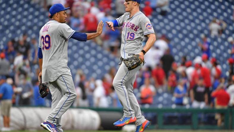 Aug 21, 2022; Philadelphia, Pennsylvania, USA; New York Mets relief pitcher Edwin Diaz (39) and left fielder Mark Canha (19) celebrate win against the Philadelphia Phillies at Citizens Bank Park. Mandatory Credit: Eric Hartline-USA TODAY Sports