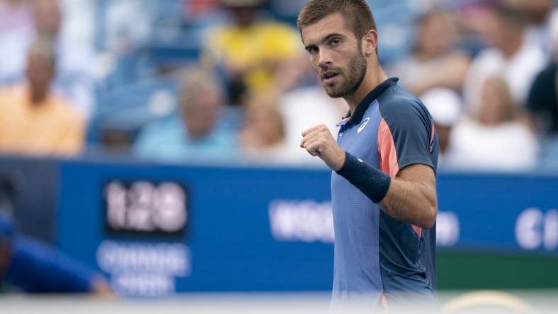 Aug 21, 2022; Cincinnati, OH, USA; Borna Coric (CRO) reacts to a shot during the men   s final match against Stefanos Tsitsipas (GRE) at the Western & Southern Open at the Lindner Family Tennis Center. Mandatory Credit: Susan Mullane-USA TODAY Sports