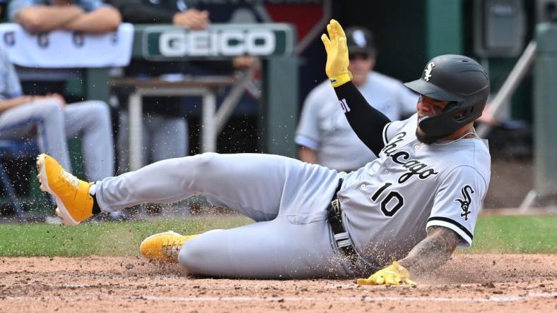 Aug 22, 2022; Kansas City, Missouri, USA;  Chicago White Sox third baseman Yoan Moncada (10) slides into home plate to score a run during the fourth inning against the Kansas City Royals at Kauffman Stadium. Mandatory Credit: Peter Aiken-USA TODAY Sports