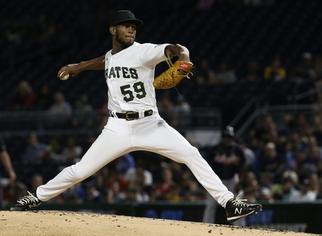 Aug 22, 2022; Pittsburgh, Pennsylvania, USA; Pittsburgh Pirates starting pitcher Roansy Contreras (59) pitches against the Atlanta Braves during the second inning at PNC Park. Mandatory Credit: Charles LeClaire-USA TODAY Sports