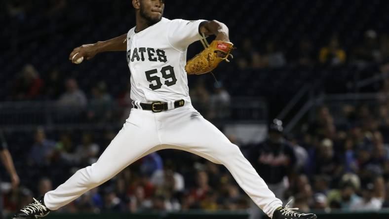 Aug 22, 2022; Pittsburgh, Pennsylvania, USA; Pittsburgh Pirates starting pitcher Roansy Contreras (59) pitches against the Atlanta Braves during the second inning at PNC Park. Mandatory Credit: Charles LeClaire-USA TODAY Sports