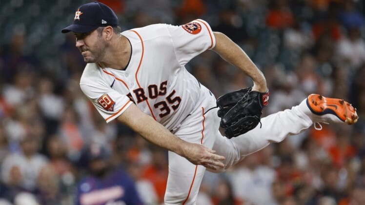 Aug 23, 2022; Houston, Texas, USA; Houston Astros starting pitcher Justin Verlander (35) delivers a pitch during the first inning against the Minnesota Twins at Minute Maid Park. Mandatory Credit: Troy Taormina-USA TODAY Sports