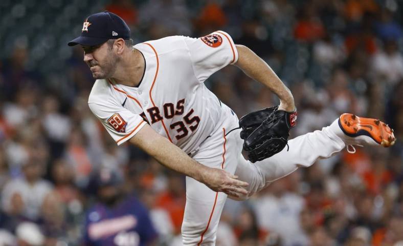 Aug 23, 2022; Houston, Texas, USA; Houston Astros starting pitcher Justin Verlander (35) delivers a pitch during the first inning against the Minnesota Twins at Minute Maid Park. Mandatory Credit: Troy Taormina-USA TODAY Sports