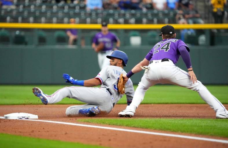 Aug 23, 2022; Denver, Colorado, USA; Colorado Rockies third baseman Ryan McMahon (24) tags out Texas Rangers center fielder Leody Taveras (3) in the first inning at Coors Field. Mandatory Credit: Ron Chenoy-USA TODAY Sports