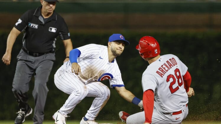 Aug 23, 2022; Chicago, Illinois, USA; Chicago Cubs second baseman Nick Madrigal (1) tags out St. Louis Cardinals third baseman Nolan Arenado (28) at second base during the eight inning of the second game of the doubleheader at Wrigley Field. Mandatory Credit: Kamil Krzaczynski-USA TODAY Sports