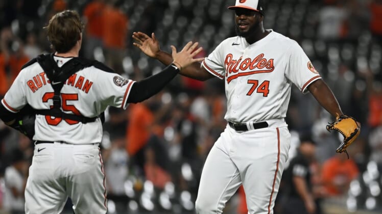 Aug 23, 2022; Baltimore, Maryland, USA;  Baltimore Orioles relief pitcher Felix Bautista (74) celebrates with catcher Adley Rutschman (35) after the game against the Chicago White Sox at Oriole Park at Camden Yards. Mandatory Credit: Tommy Gilligan-USA TODAY Sports