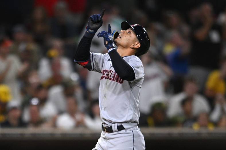 Aug 23, 2022; San Diego, California, USA; Cleveland Guardians second baseman Andres Gimenez (0) gestures while rounding the bases after hitting a home run against the San Diego Padres during the fifth inning at Petco Park. Mandatory Credit: Orlando Ramirez-USA TODAY Sports